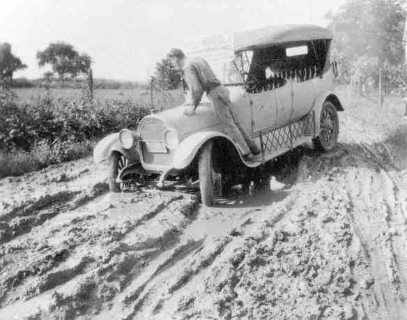 J+B-103_car-in-mud_1920s